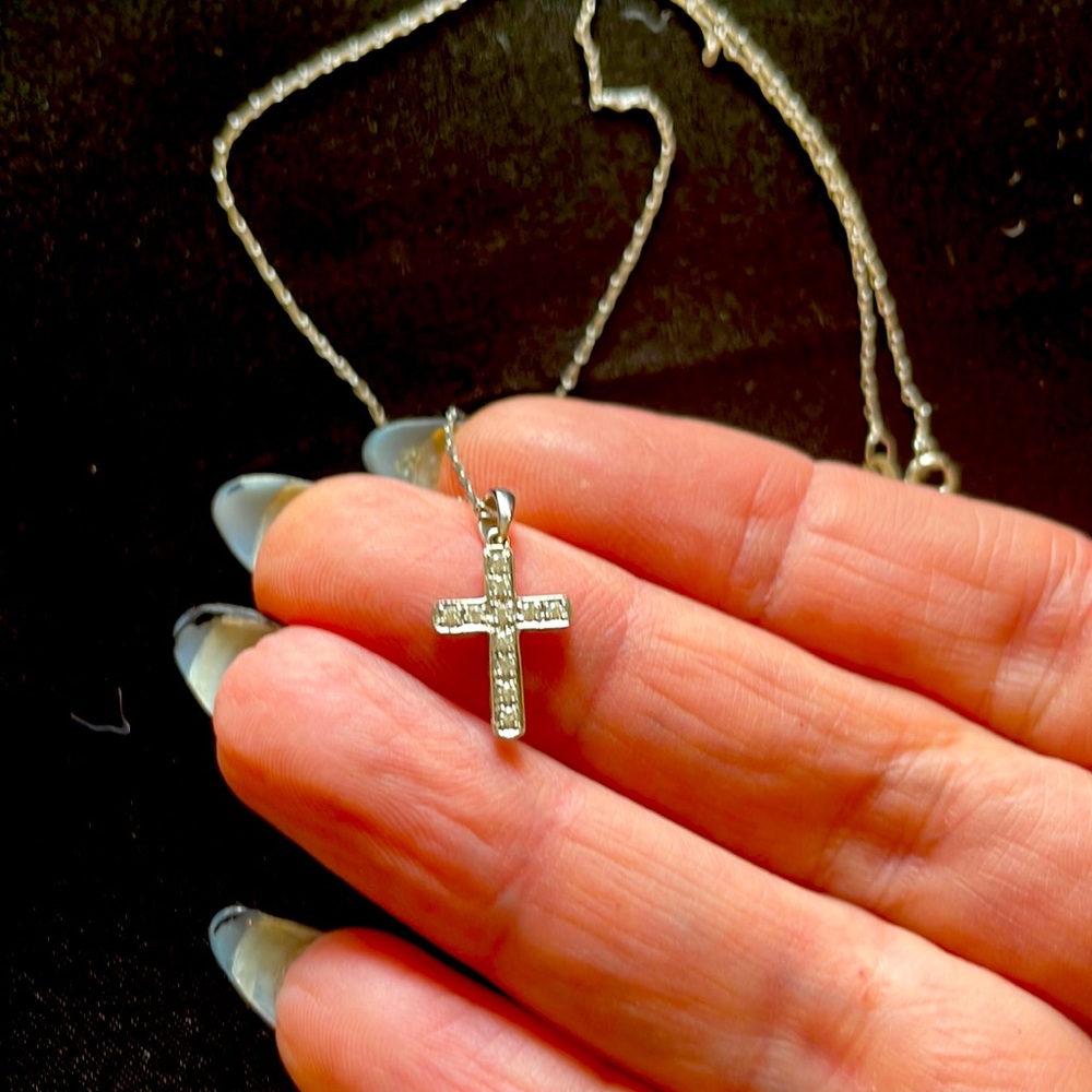 Child’s diamond cross in white gold